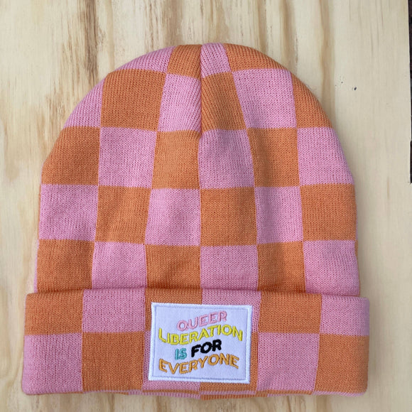 Plaid beanie with patch reading 