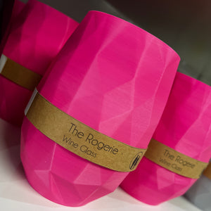 Pink plastic tumblers with thin cardboard belly band. 