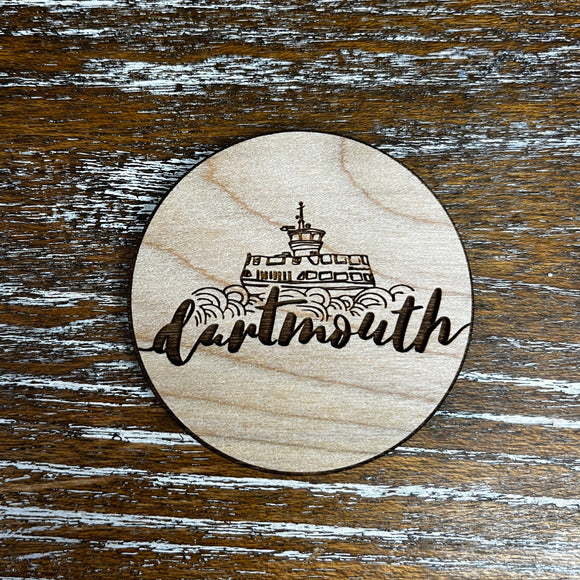 Round wooden magnet with laser engraved design, a line drawn Dartmouth Ferry and script font reading 