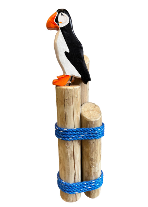 Large Puffin on wood pilings