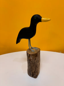 Cormorant on a single piling