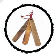 Three wooden bookmarks with rounded edges lay over each other with a black circle frame highlighting all three
