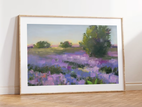 Framed print of a pastel impressionist painting of a field of lavender with trees..