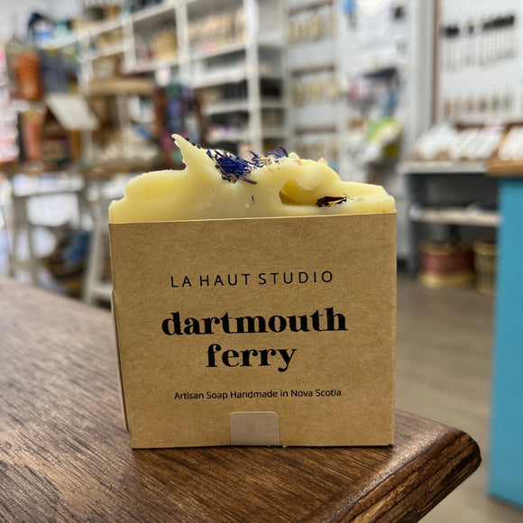 Photo of a white soap bar wrapped in a kraft paper label reading Dartmouth Ferry