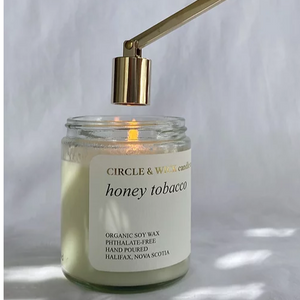 Honey tobacco candle with gold wick snuffer